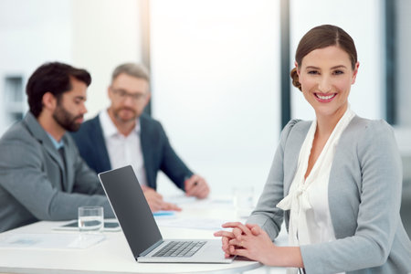 Shes a leader in the making. Portrait of a businesswoman sitting in a boardroom meeting with...