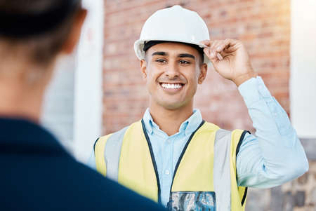 Building, construction and architecture worker with a happy smile ready to start work. Maintenance contractor, builder logistics and building construction worker feeling motivation for a job projectの写真素材