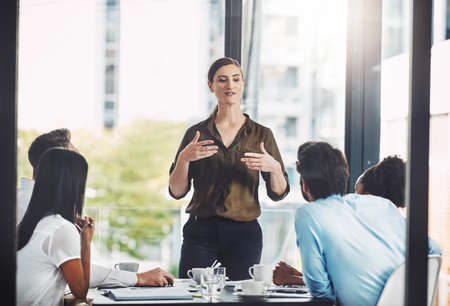 Its important to keep an open mind as a team leader. a businesswoman giving a presentation to her...