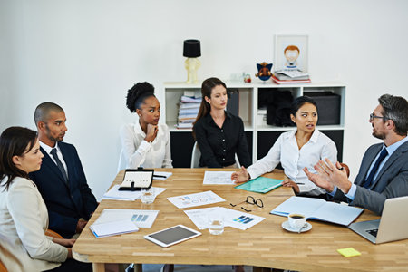 Teamwork is a good way to achieve success. a group of businesspeople meeting in the boardroom.