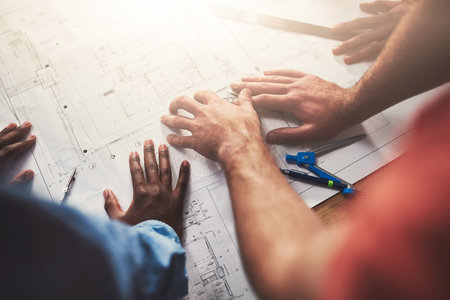 Its all about attention to detail. Closeup shot of architects working together on a project in an office.の写真素材