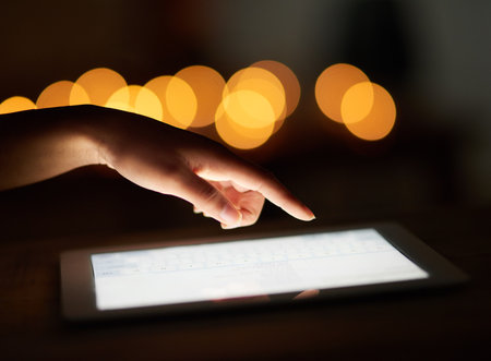 Nothing is out of reach anymore. an unrecognizable person using a digital tablet.の写真素材