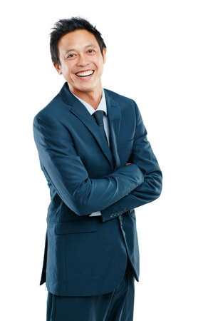 Im up for the challenge. Studio portrait of a handsome young businessman posing against a white background.の写真素材