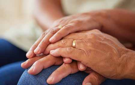 Couple holding hands for support and love, gratitude for help and support and kindness in retirement...