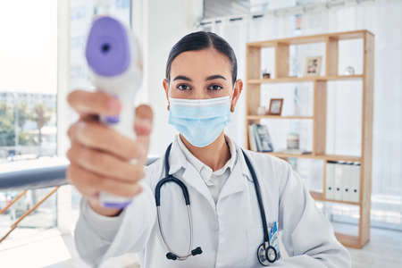 Covid doctor thermometer, safety check and corona virus risk in hospital, clinic and medical...