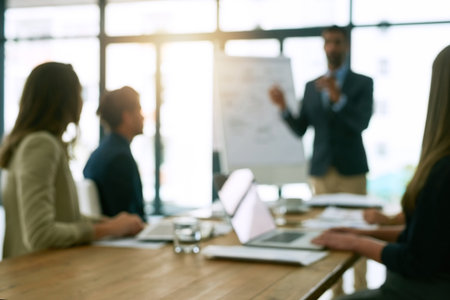 Success happens in the boardroom. a group of corporate businesspeople meeting in the boardroom.の写真素材