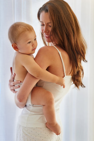 Cant take my eyes off your cuteness. a mother spending quality time with her baby boy at home.の写真素材