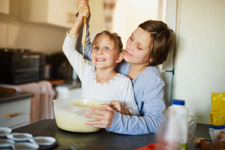 Baking is bliss. two young siblings baking together at home.