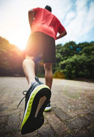 Take your next sweat session outside. Rearview shot of a man out for a run.