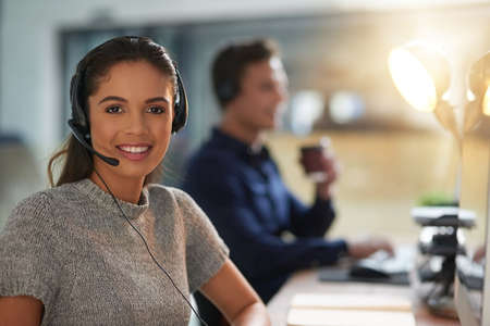 Let them assist you. young agents working in a call center.