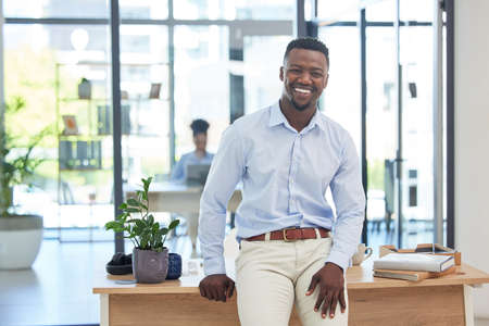 Smiling, motivated and ambitious business man feeling excited about a new job opportunity in...