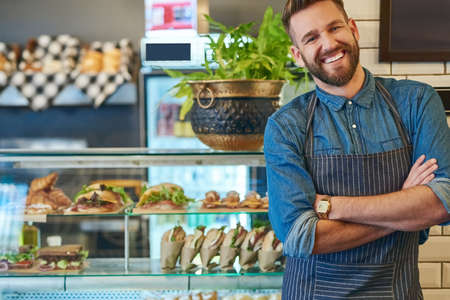 What started as a dream is now my biggest achievement. Portrait of a proud business owner standing in his store.の写真素材