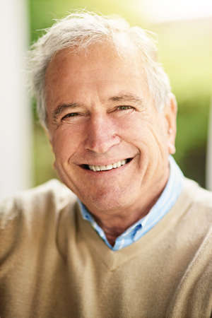 Theres so much to smile about. Portrait of a happy senior man standing outside.