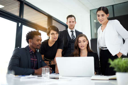 Getting the job done. a group of business colleagues meeting in the boardroom.の写真素材