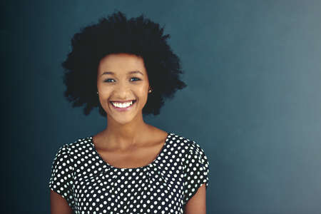 Success always make me smile. Portrait of an attractive young businesswoman posing in the studio.