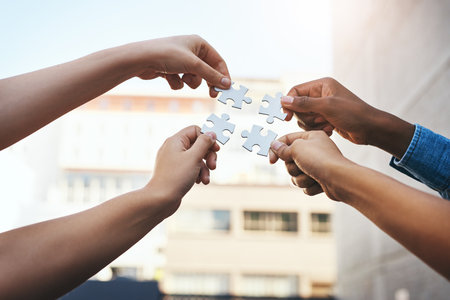 Well find the solution if we work together. Closeup shot of a group of unidentifiable people joining...