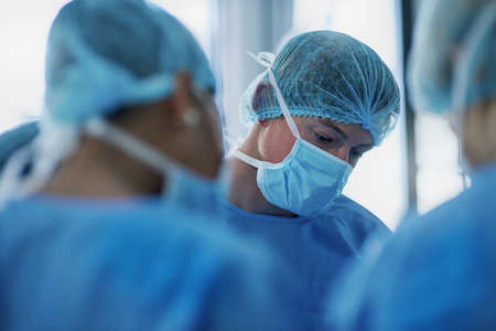 Attention to detail is of paramount importance in surgical procedures. a team of surgeons performing...
