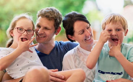 Theyre a family full of character. Portrait of a happy family bonding together outside.