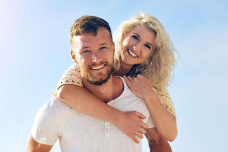 I will spoil her with endless love. n affectionate couple spending the day at the beach.の写真素材