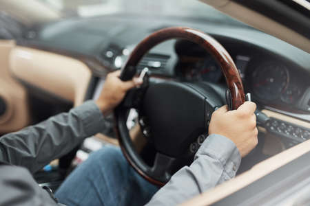 One small move can change your whole direction. hands holding onto a steering wheel while driving.
