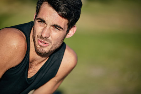 Worry less, run more. a young man out for a run in the park.の写真素材