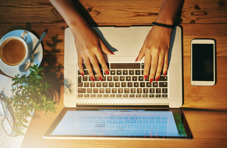 Shes a hands-on entrepreneur. High angle shot of a woman working on a laptop.