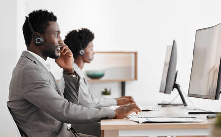 Support, consulting and a black man and woman in call center with headset and computer, help in...