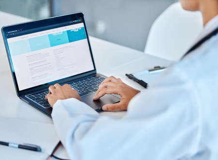Laptop, medical and healthcare with a doctor working online in an office in the hospital for...