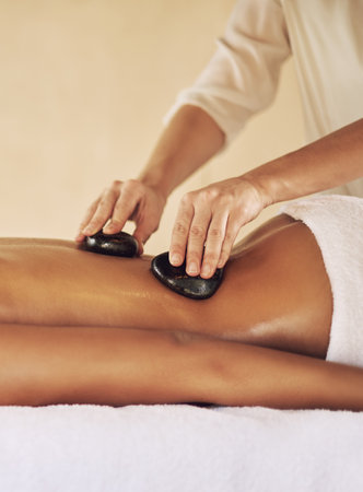 Get a massage, just for the health of it. a young woman enjoying some lastone therapy at the spa.