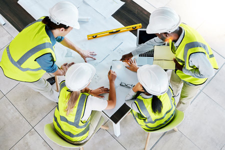 Engineer, architect or construction team workers working on creative innovation, planning and strategy design plan for building. Teamwork, meeting and industrial architecture business model ideaの写真素材