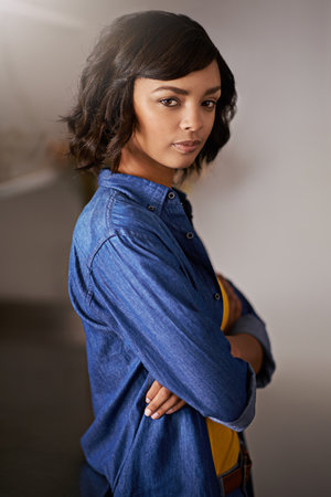 Shes young, confident and knows what she wants. Portrait of a young woman at home.