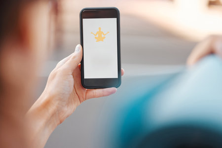 Yoga, meditation and peace phone app of a online wellness, spiritual and health website. 5g internet, technology and mobile screen showing fitness studio logo with a woman ready to start a workoutの写真素材