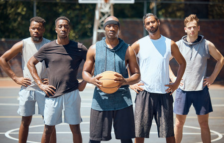 Portrait of a sports basketball team training for a game on an outdoor professional court. Workout, athletes and healthy group of men preparing with exercise and fitness for match on a playing field.の写真素材