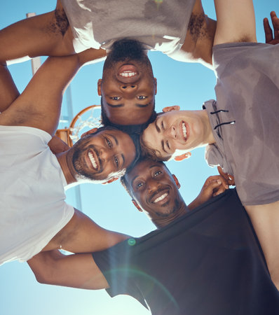 Teamwork, diversity and basketball player huddle from bottom, together for fitness, game and sports strategy planning. Collaboration, community and motivation with basketball athlete in supportの写真素材