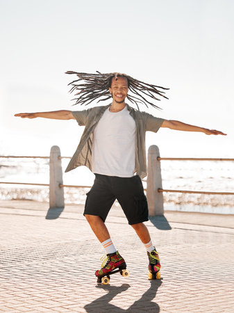 Training, sports and skate with a man roller skating on the promenade by the beach with the sea in...