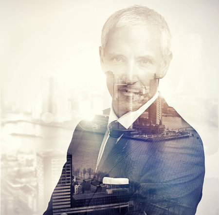 Hes put his mark on this city. Portrait of a handsome businessman superimposed over a cityscape.