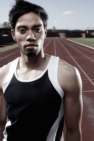 I am a winner.A yougn runner looking at the camera confidently.の写真素材