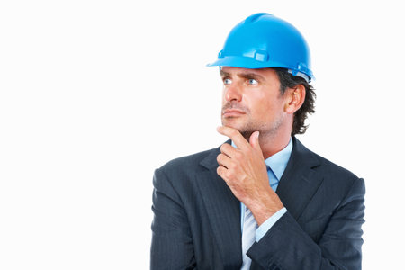 Thoughtful architect. Closeup of thoughtful architect looking at copyspace against white background.