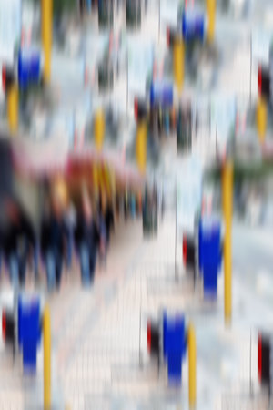 Motion blurred city life. Motion and lens blurred photo of city people.の写真素材