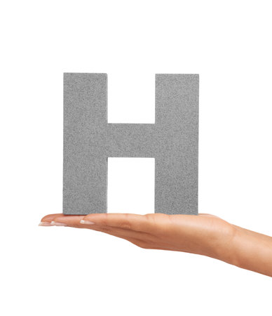 How do you do. A young woman holding a capital letter H isolated on a white background.の写真素材