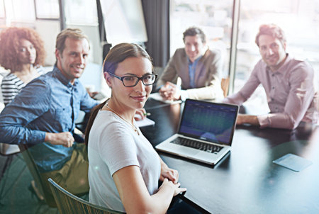 We push the limits of success. Portrait of a group of office colleagues sitting around a boardroom...
