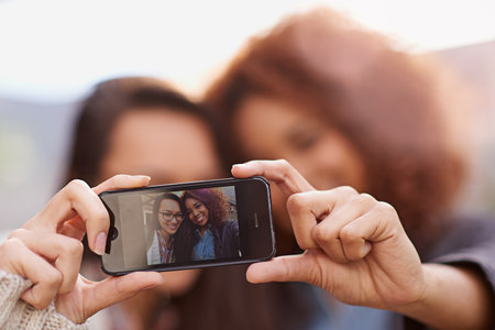 Fun day selfie. girlfriends taking a selfie together.