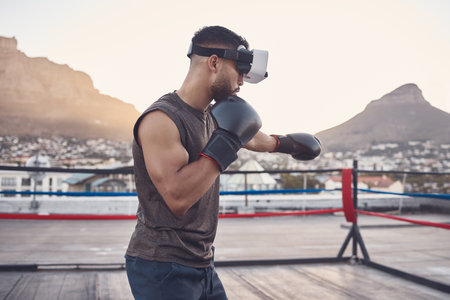 Virtual reality, boxing and sports man training for fight, fitness or exhibition competition in a boxing ring. Vr headset or goggles, metaverse and boxer workout with exercise innovation gamer techの写真素材