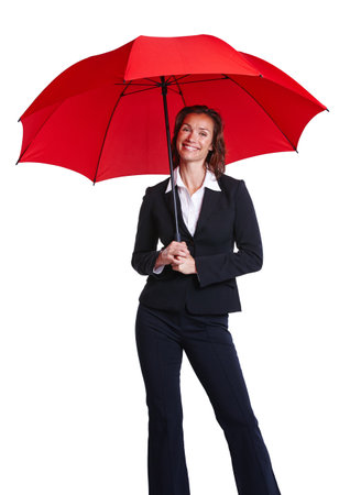 Ready for a rainy day. Cropped studio portrait of a woman wearing a suit and holding an umbrella.の写真素材