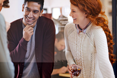 Fresh new ideas. a team of young designers discussing their work.の写真素材