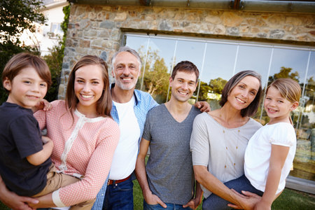 Welcomed by happy faces. A cropped portrait of a happy multi-generational family standing outside in...