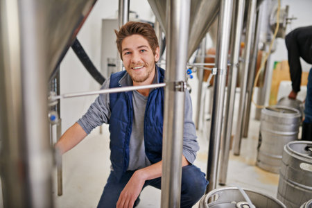 Your lager is on its way. Portrait of a man working in a microbrewery.の写真素材