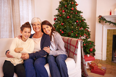 Together we make a family. Show of three-generations of a family celebrating christmas together.