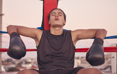Sports, boxing ring and tired frustrated boxer with low energy, injury or fatigue from exhibition...