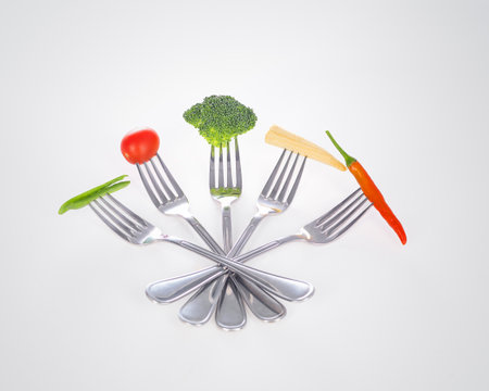 Mouthful of goodness. A series of forks with healthy mouthfuls of vegetables on them.の写真素材